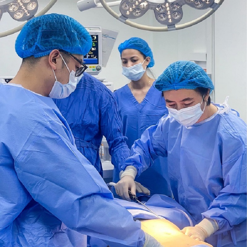 The doctor performs surgery in a sterile procedure room