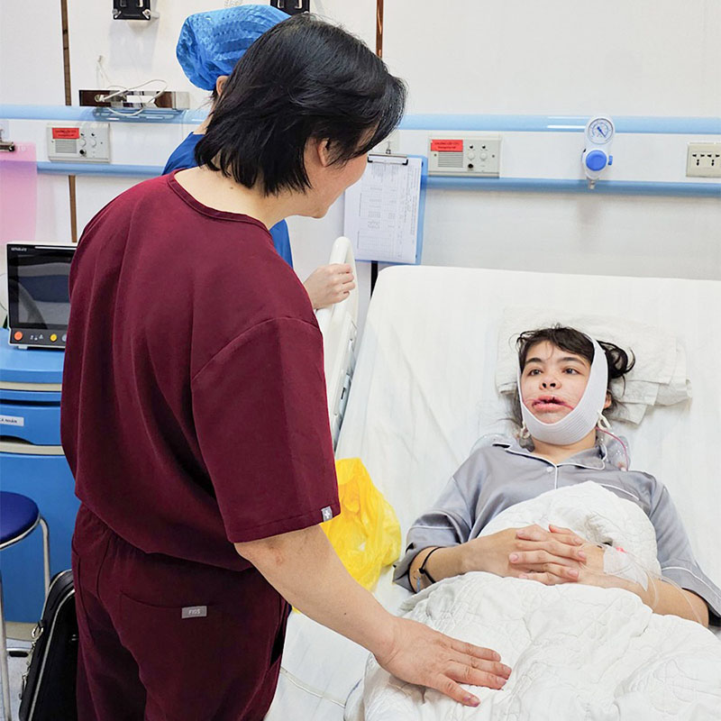 Doctor examines patient after surgery